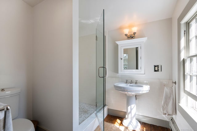 44 S St, Roxbury, CT 06783 - bathroom with baseboard heating, a shower stall, wood finished floors, a sink, and toilet