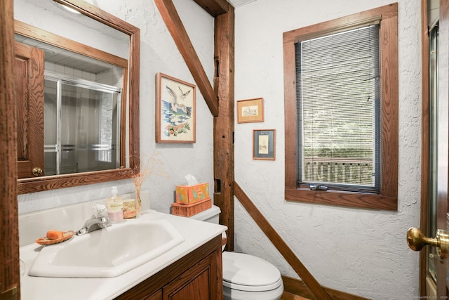 148 Flanders Rd, Woodbury, CT 06798 - bathroom featuring toilet, a textured wall, vanity, and a stall shower