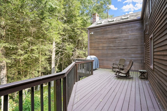 wooden deck with grilling area