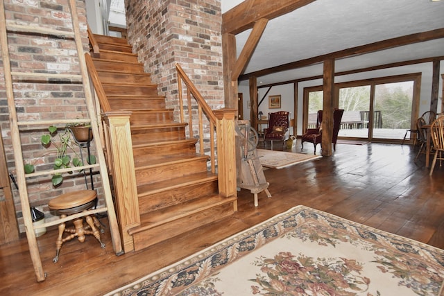 148 Flanders Rd, Woodbury, CT 06798 - staircase featuring wood-type flooring and beam ceiling