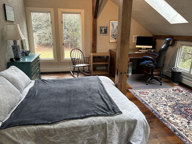 148 Flanders Rd, Woodbury, CT 06798 - bedroom with a skylight, wood finished floors, lofted ceiling, a desk, and baseboard heating