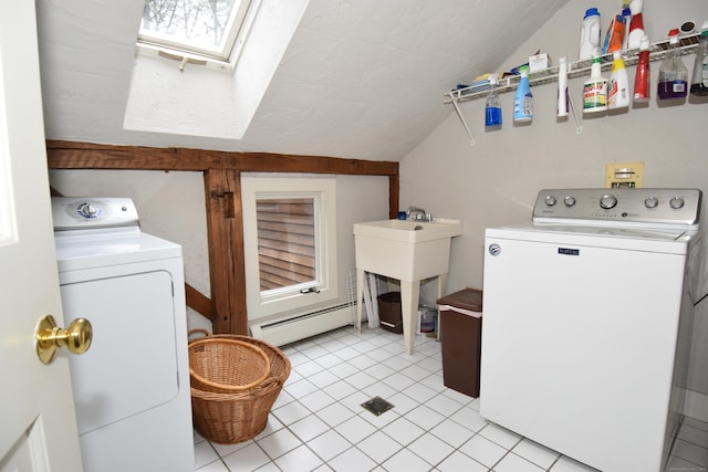 148 Flanders Rd, Woodbury, CT 06798 - laundry room featuring separate washer and dryer, a baseboard radiator, a textured ceiling, light tile patterned floors, and a skylight