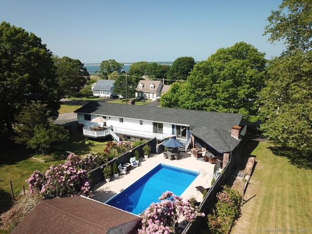 view of pool featuring a patio and a lawn