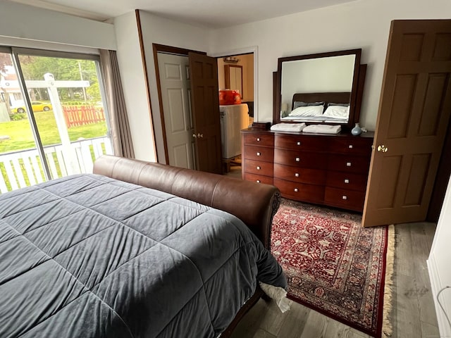 bedroom with a closet and hardwood / wood-style floors