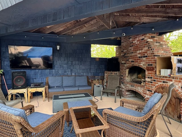 view of patio featuring an outdoor living space with a fireplace and a gazebo