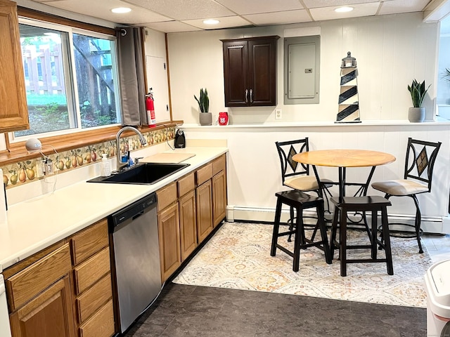 kitchen with dishwasher, electric panel, sink, a paneled ceiling, and light tile patterned floors