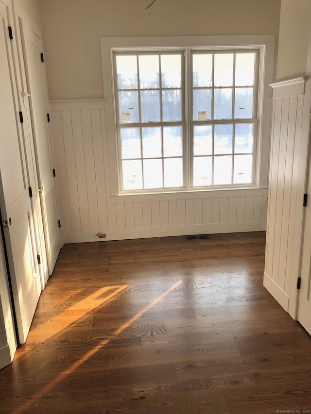 empty room with dark wood-type flooring