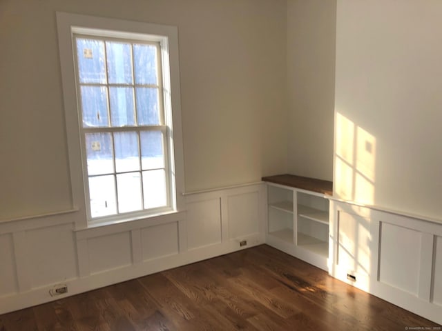 empty room with dark hardwood / wood-style floors