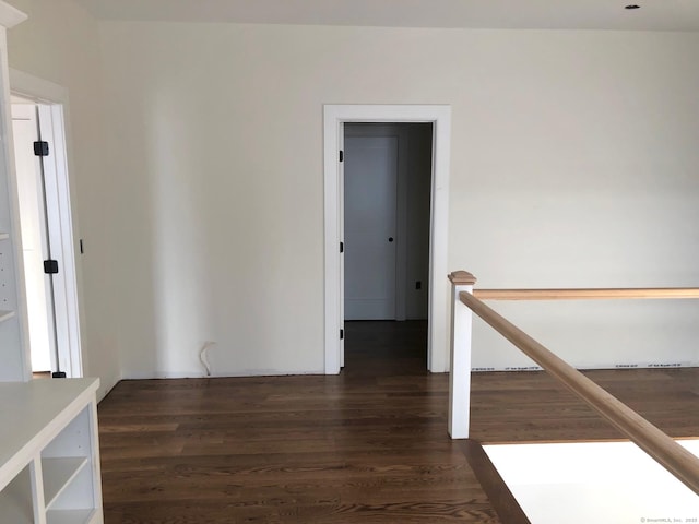 spare room with dark hardwood / wood-style flooring