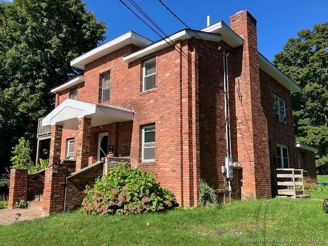 exterior space with a front lawn