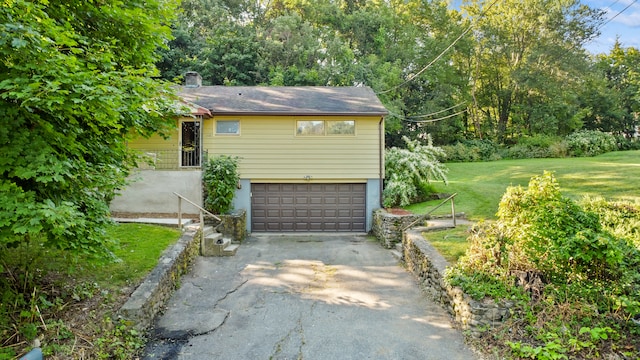 garage featuring a lawn