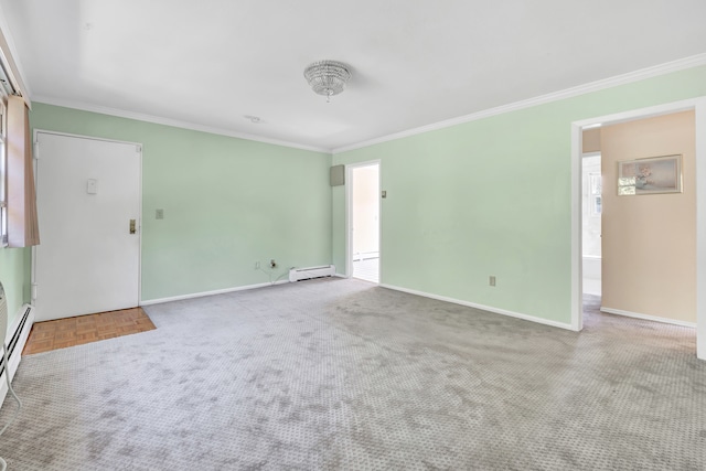 carpeted empty room featuring ornamental molding and a baseboard heating unit