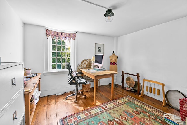 office area with hardwood / wood-style floors