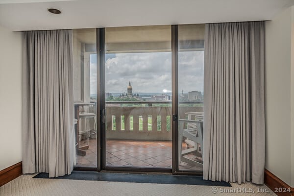 doorway featuring carpet