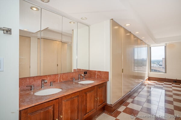 bathroom featuring backsplash and vanity