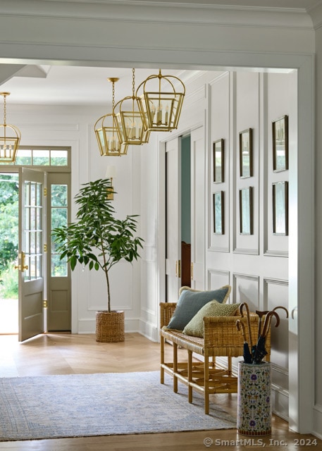 interior space featuring hardwood / wood-style flooring and a chandelier