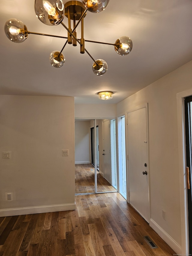 foyer with dark hardwood / wood-style flooring