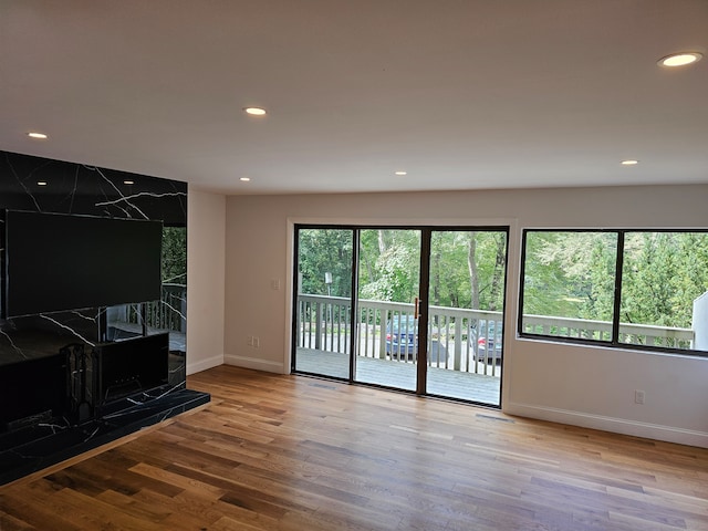 unfurnished living room with light wood-type flooring