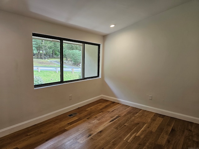 unfurnished room featuring hardwood / wood-style flooring