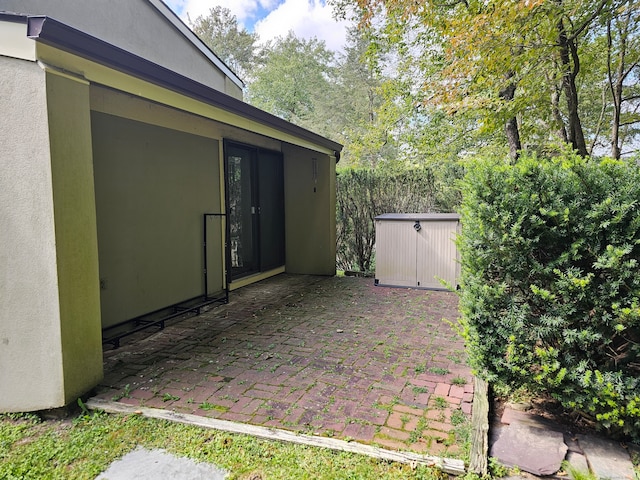 view of patio / terrace with a storage shed