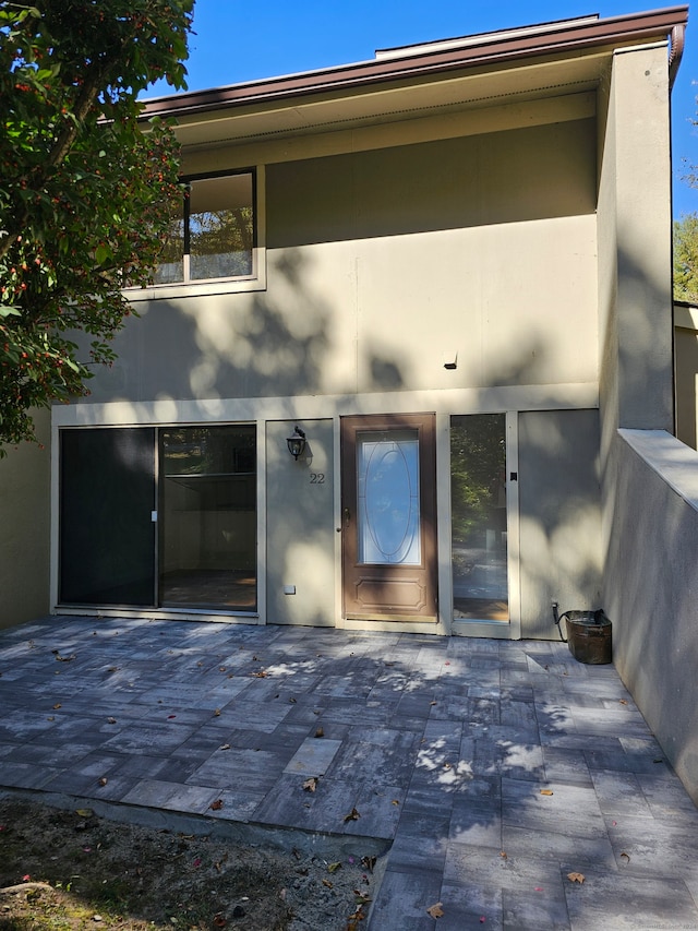 entrance to property with a patio area