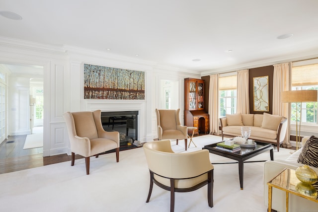 living room featuring hardwood / wood-style floors and ornamental molding