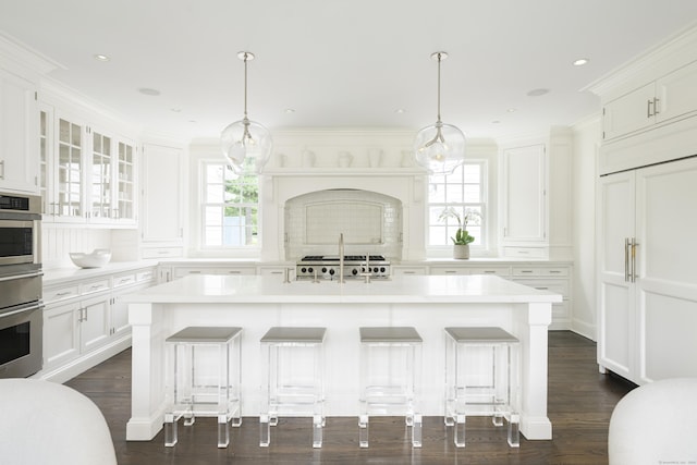 865 Hollow Tree Ridge Rd, Darien, CT 06820 - kitchen featuring light countertops, oven, white cabinets, a breakfast bar, and dark wood-style flooring