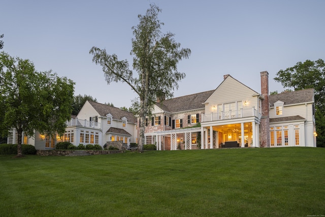 865 Hollow Tree Ridge Rd, Darien, CT 06820 - rear view of property featuring french doors, a balcony, a yard, and a chimney