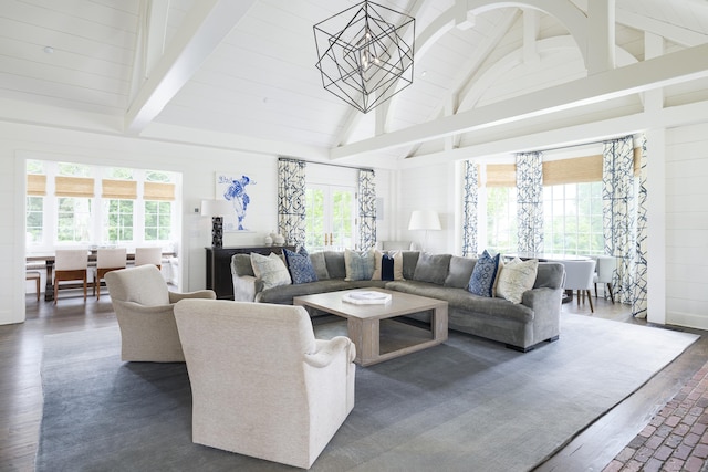 865 Hollow Tree Ridge Rd, Darien, CT 06820 - living area with dark wood-style floors, beamed ceiling, plenty of natural light, a chandelier, and high vaulted ceiling