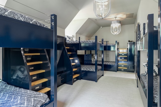 bedroom with carpet floors and a chandelier