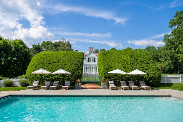 view of pool featuring a patio area