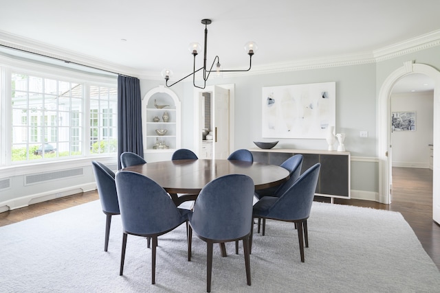 865 Hollow Tree Ridge Rd, Darien, CT 06820 - dining area with ornamental molding, wood finished floors, arched walkways, a chandelier, and baseboards