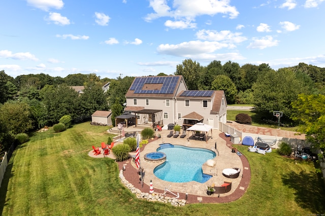 view of pool with a gazebo, a lawn, a storage unit, and a patio