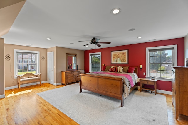 bedroom featuring light hardwood / wood-style flooring and ceiling fan