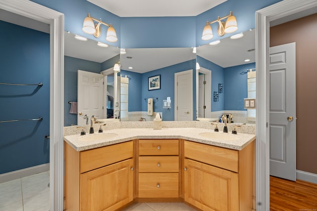 bathroom featuring wood-type flooring and vanity