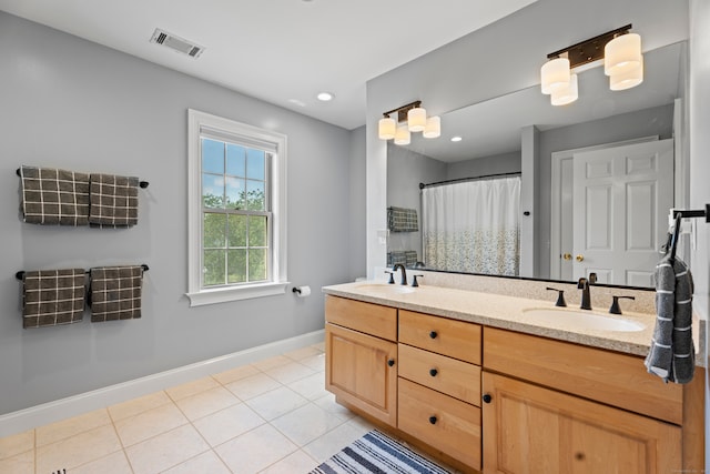 bathroom featuring vanity, walk in shower, and tile patterned floors