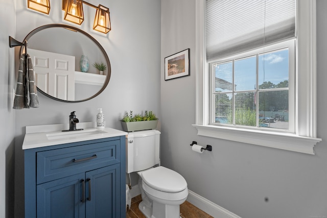 bathroom with vanity and toilet