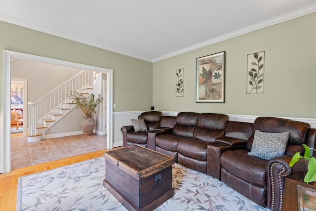 living room with crown molding and light hardwood / wood-style floors