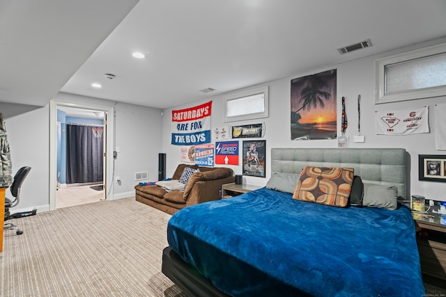 bedroom featuring light colored carpet