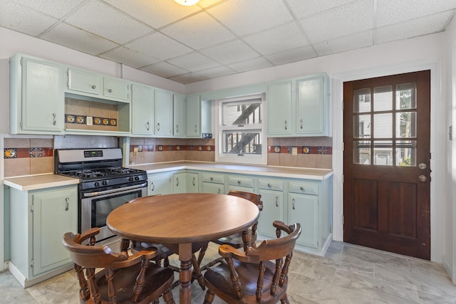 85 Aetna St Apt 12, Naugatuck, CT 06770 - kitchen featuring stainless steel gas range, a paneled ceiling, plenty of natural light, and light countertops