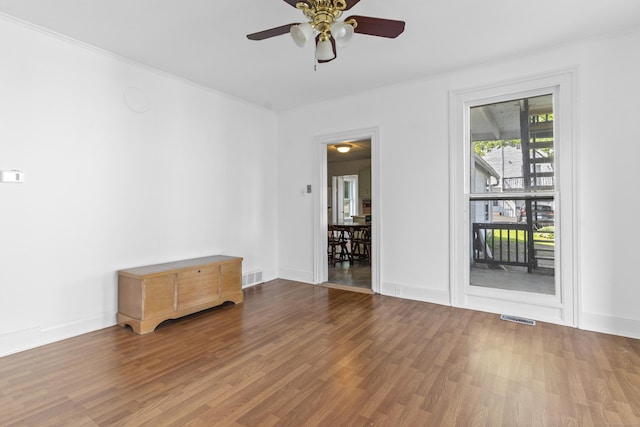 85 Aetna St Apt 12, Naugatuck, CT 06770 - empty room with wood finished floors, ceiling fan, ornamental molding, and baseboards