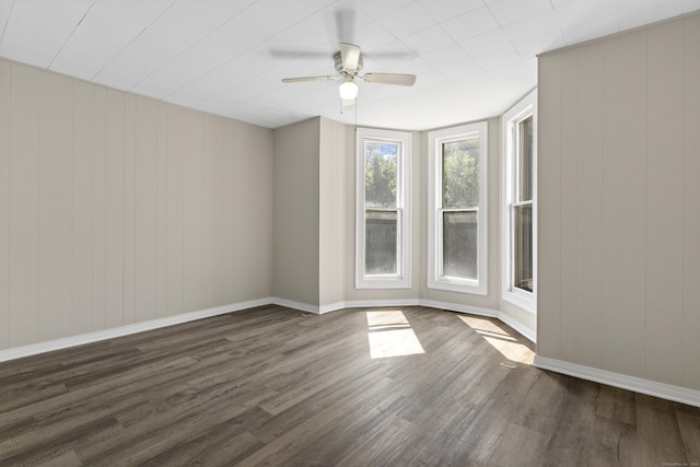 85 Aetna St Apt 12, Naugatuck, CT 06770 - unfurnished room with dark wood-style flooring, ceiling fan, and baseboards
