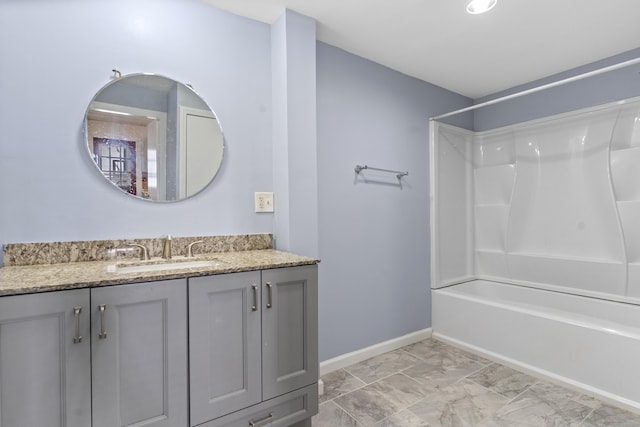 85 Aetna St Apt 12, Naugatuck, CT 06770 - bathroom featuring vanity,  shower combination, baseboards, and marble finish floors