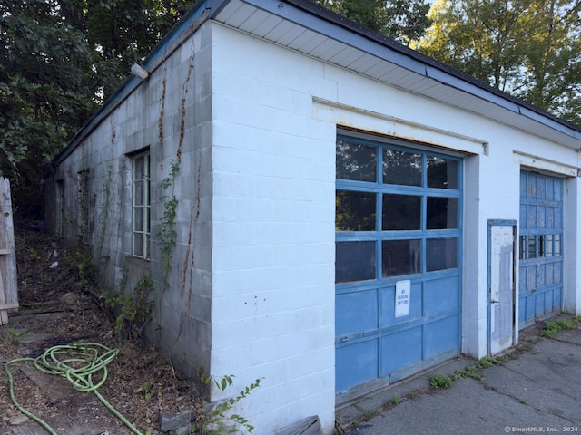 view of property exterior with a garage