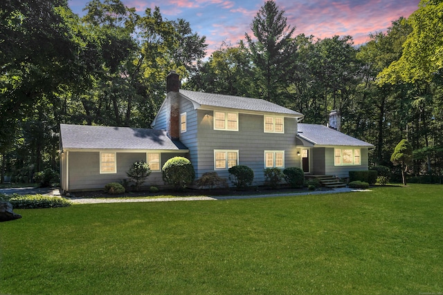 view of front of property with a yard