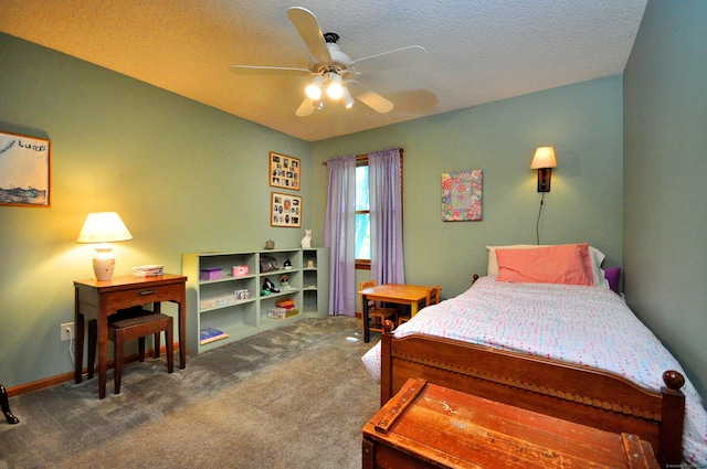 bedroom featuring carpet flooring, ceiling fan, and a textured ceiling