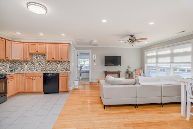 kitchen with black appliances, light hardwood / wood-style flooring, a healthy amount of sunlight, and tasteful backsplash