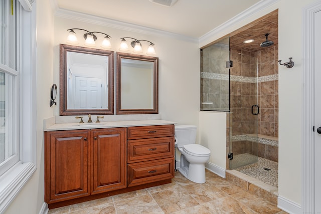 bathroom with vanity, crown molding, toilet, and walk in shower