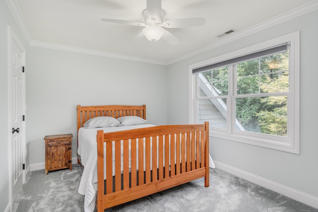 bedroom featuring ceiling fan, carpet flooring, and ornamental molding