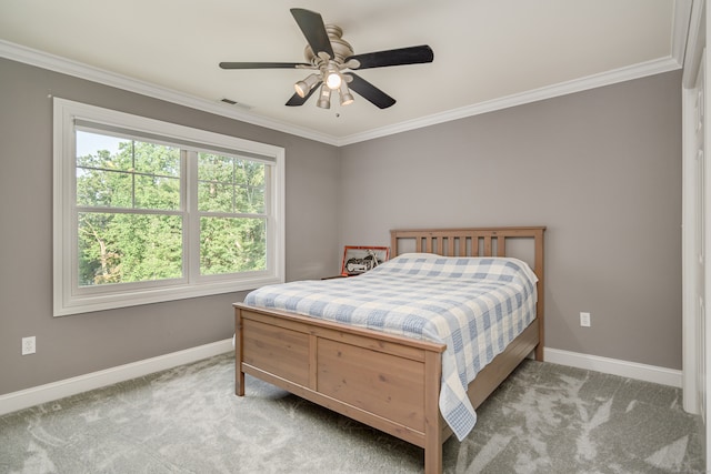 bedroom with ceiling fan, light carpet, and ornamental molding